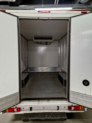 interior refrigerated truck is insulated and hygienically white for transporting goods and...
