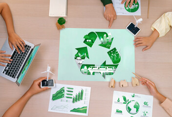 Eco city and recycle illustration placed on a meeting table during a green business meeting...