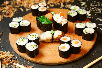 Wooden Plate With Sushi and Chopsticks