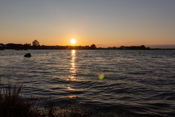 Naklejka premium sunset over the river