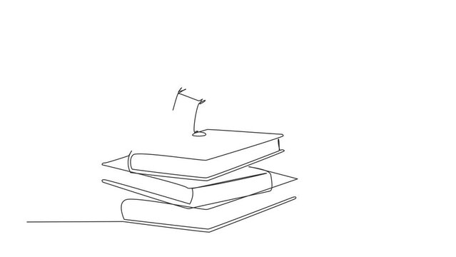 Single continuous line drawing of young businessman standing on stacks of giant books fist hands up. Successful entrepreneur. Full length animated