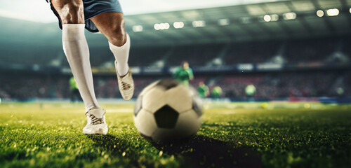 Male legs, football player in motion on filed dribbling ball, playing soccer at 3D stadium model with blurred tribune on background. Concept of professional sport, competition, tournament