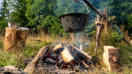 Cooking at campfire with adventure	