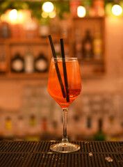 Alcoholic cocktail with straws. Bar