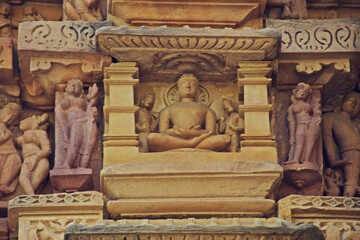A finely detailed stone sculpture of a Jain Tirthankara ADINATH, with a serene expression,...