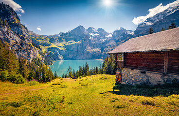Colorful summer morning on unique lake - Oeschinen (Oeschinensee), UNESCO World Heritage Site....