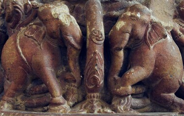 Fototapeta na wymiar Pair of elephant figures on a wall at Khujraho, Madhya Pradesh 