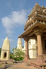 A serene Jain temple with intricate carvings and statues, radiating peace and spirituality. at...