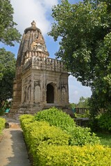 Fototapeta na wymiar Intricate Architecture of Ancient Temple Adinath temple, Khajuraho, Madhya Pradesh, India