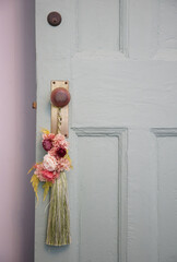 Flowers on the handle of the entrance door of the room