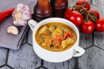 Traditional yellow Thai curry with chicken