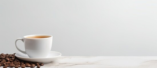 A cup of coffee and coffee beans on a table - obrazy, fototapety, plakaty