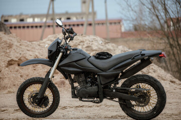 Obraz na płótnie Canvas custom homemade motard enduro motorcycle for city and off-road riding in matte black color.