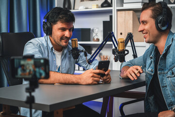 Host channel of creative broadcaster living by smartphone in positive podcast with special guest in...