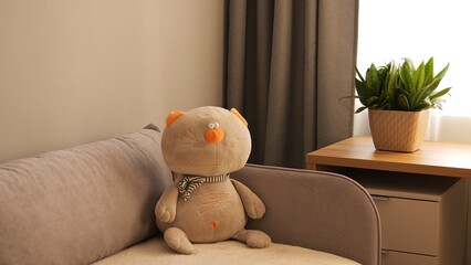 Soft plush toy rests on the sofa, a delightful addition to any space. Explore our diverse range of...