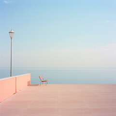Table on the beach. Blue sky and sea. Summer concept in pastel colors.