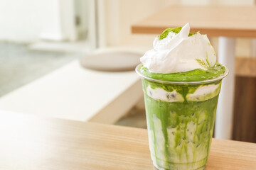 Matcha with cream latte on top at cafe in seoul korea,popular menu in seoul korea and japan,Matcha green tea,Space for text.