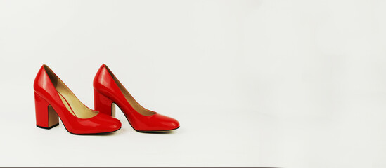 a white banner with a place for the inscription red patent leather heeled shoes