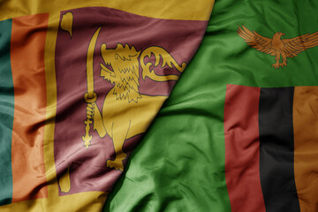 big waving national colorful flag of zambia and national flag of sri lanka .