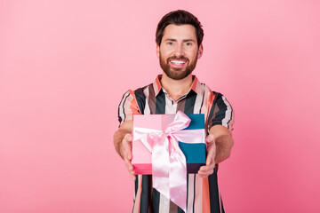 Photo of happy young smiling husband give you surprise gift box celebrate anniversary ten years...