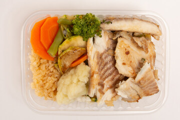 Healthy fish packed lunch box meal in front top aerial view clean white background