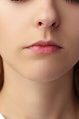 Obraz premium Close up of a young woman with nude make up