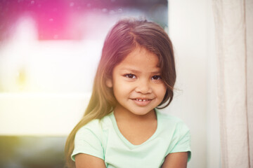 Girl, kid and smile for portrait in home, cute and sweet in lounge with happiness in family house....