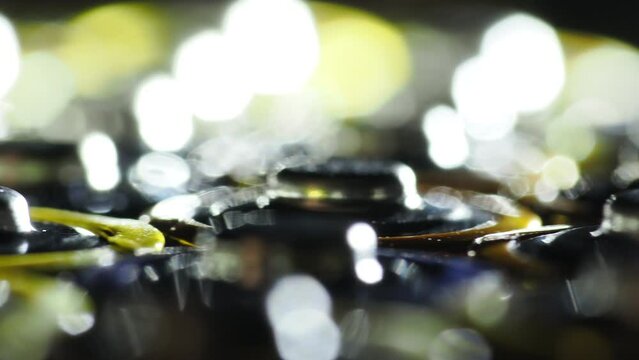 Flashing lights on group of rotating alkaline batteries,close up 