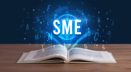 Technology abbreviation coming out from an open book