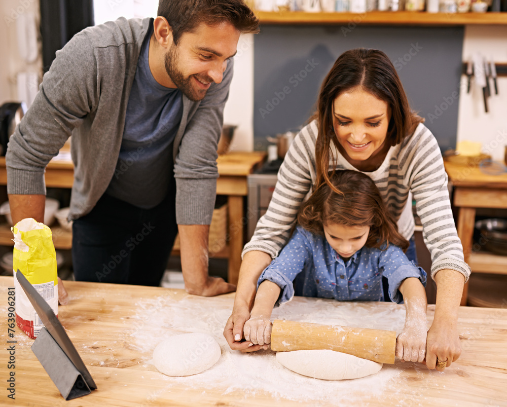 Wall mural Family, cooking and learning in kitchen with tablet for recipe, guide and parents with child in home. Baking, mom and dad helping girl with rolling pin and talking about pizza, dinner or meal prep