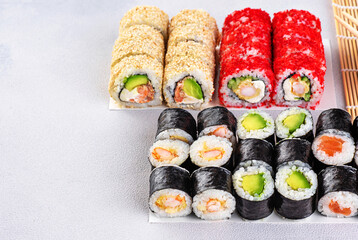Popular types of sushi. Set of sushi roll on a gray background.