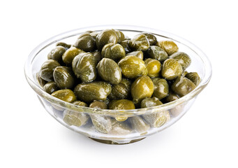 Pickled capers in a glass bowl on a white background. With clipping path.