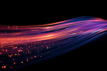 Glowing orange and purple light streaks against dark background