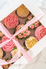 Delicious Gourmet Cupcakes Topped with Buttercream Frosting Flowers
