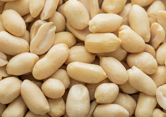 Healthy blanched peanut nuts top view macro background.Top view.