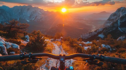 A mountain biker riding down a trail as the sun sets, casting a warm glow over the landscape. The biker navigates the rocky path with skill and agility, kicking up dust in their wake