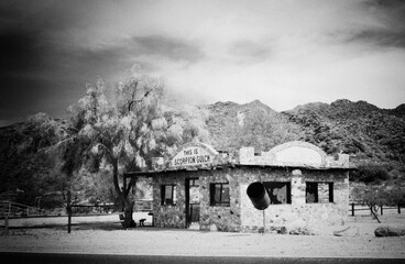 An eerie black and white image shows the abandoned 'Scorpion Gulch' store, conjuring feelings of...
