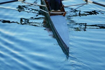 Rowers in a boat with oars on the lake