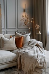 Fototapeta na wymiar Elegant living room corner with comfortable sofa, decorative pillows, knit blanket