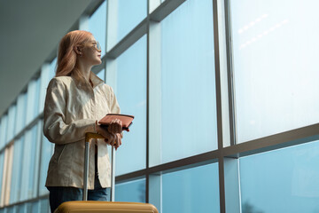 Fototapeta premium Airport travel and woman with passport, flight ticket or information of immigration, journey and luggage. identity document and international registration