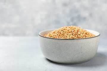 Green buckwheatin  on a wooden kitchen table.Superfood.Raw buckwheat porridge.Healthy vegan food concept, eco products, diet. Copy space.Organic food.weight loss and proper nutrition.