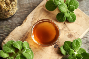 A small bowl of Coleus amboinicus syrup for common cold