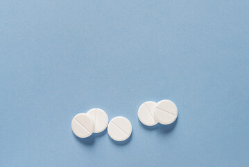 tablets on a blue background, health and medicine