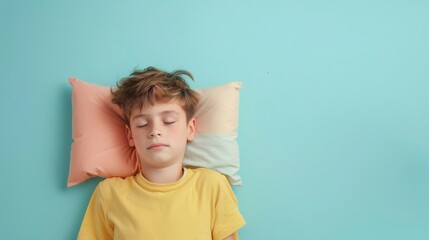 a young man sleeping on pillow isolated on pastel blue colored background. boy sleep deeply peacefully rest. Top above high angle view photo portrait of satisfied . child wear yellow shirt
 - Powered by Adobe