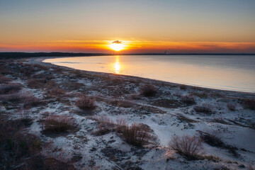 A beautiful sunset on the beach of the Sobieszewo Island at the Baltic Sea at spring. Poland - 763962676