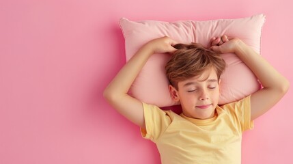 a young man sleeping on pillow isolated on pastel pink colored background. boy sleep deeply...