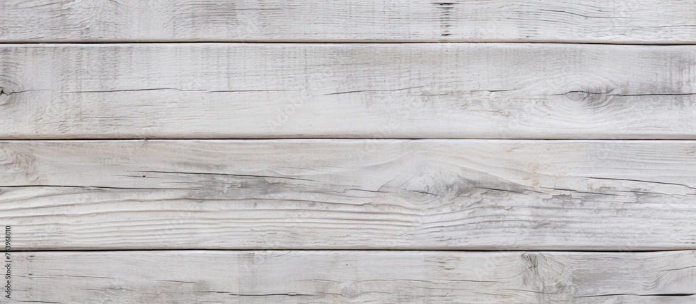 Poster a closeup of a rectangular white hardwood table on a grey flooring with parallel pattern, showcasing