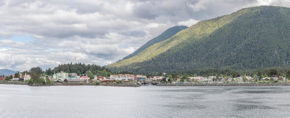 Sitka Sound and Sitka town with cloud topped mountains behind, Alaska, USA 