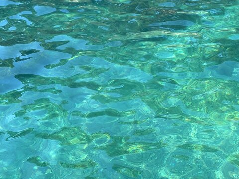 Sea water transparent blue green surface. 