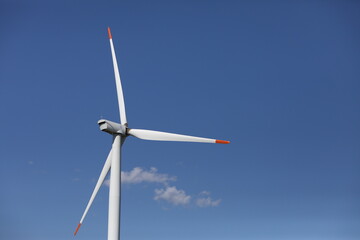 A wind turbine is a device that converts the kinetic energy of wind into electrical energy.